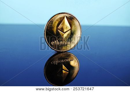 Etherum Money Crypto Currency Coin On Reflective Colorful Background