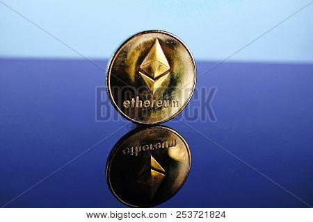 Etherum Money Crypto Currency Coin On Reflective Colorful Background