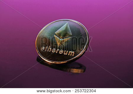 Etherum Money Crypto Currency Coin On Reflective Colorful Background