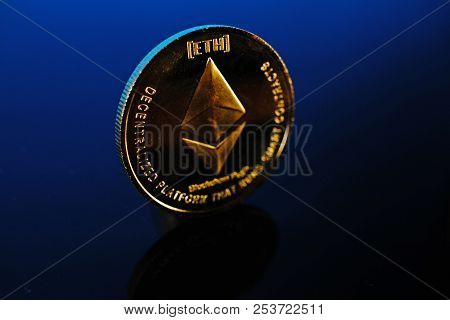 Etherum Money Crypto Currency Coin On Reflective Colorful Background