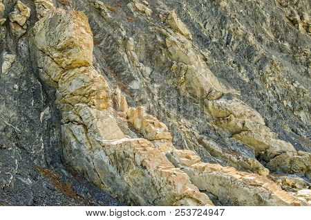 Outcrop Of Dark Gray Mudstone With Light Marl Layers