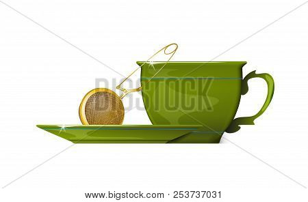 Gold Tea Strainers And Green Cup Of Tea Isolated.