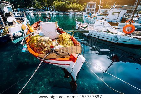Colorful Greek Fishing Boats In Small Port Harbor Of Kioni On Ithaka Island, Greece