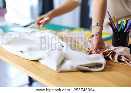 Fashion Designer Woman Working On Her Designs In The Studio.