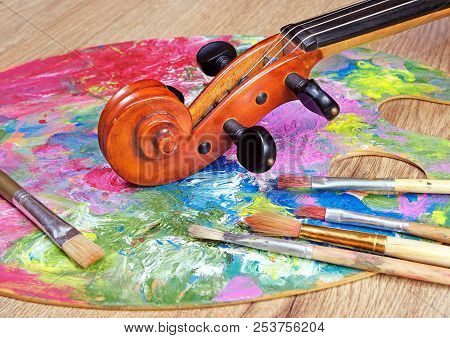 Violin, Brushes And Multicilor Palette. Close Up