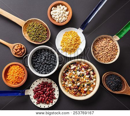 Healthy Diet Concept.top View Of Fflat Lay Of Assortment Of Legumes On Black Tabletop Background, In