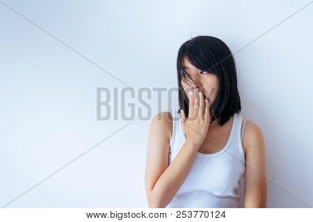 Asian Woman Covering Her Mouth And Smell Her Breath With Hands Upter Wake Up On White Blackground,ba
