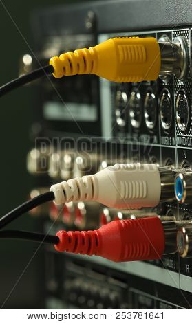 Yellow, White And Red Audio Cables And Connectors On Music Amplifier Back Panel