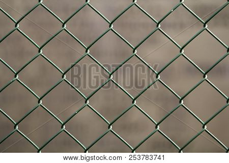 Close-up Of Isolated Painted Simple Geometric Black Iron Metal Wire Chain Link Fence Eon Dark Red Ba