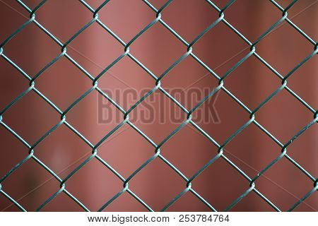 Close-up Of Isolated Painted Simple Geometric Black Iron Metal Wire Chain Link Fence Eon Dark Red Ba