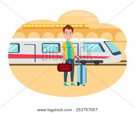 Man With Baggage Wait For Train At Railway Station. Young Cheerful Guy Wants To Migrate From Country