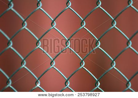 Close-up Of Isolated Painted Simple Geometric Black Iron Metal Wire Chain Link Fence Eon Dark Red Ba
