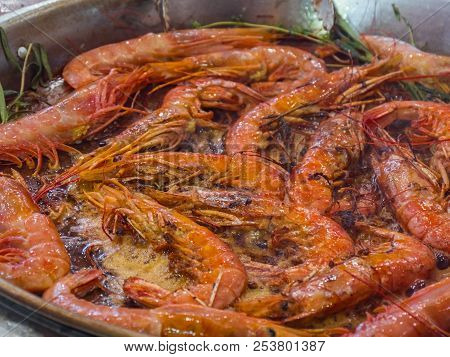 Shrimps Prawns Fried With Spices. Shrimps Prawns Are Fried In A Large Frying Pan, The Chef Prepares 