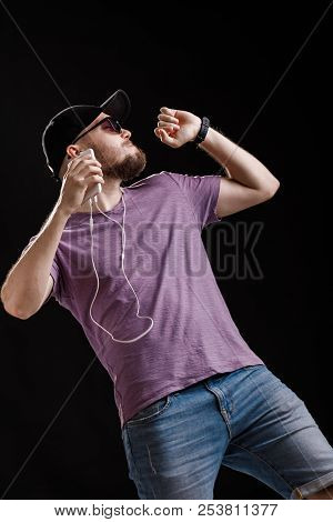 The Man Listening To Music In Headphones
