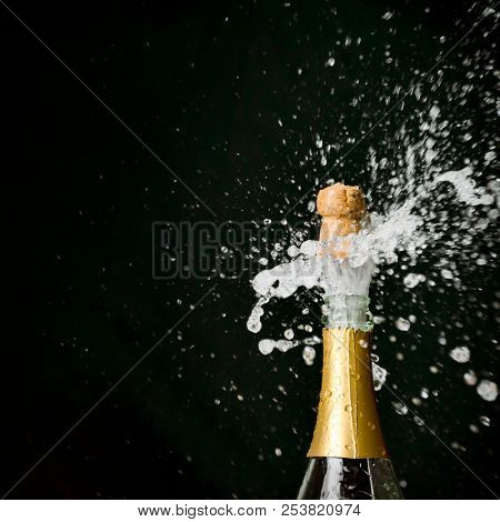 An image of a champagne cork popping out