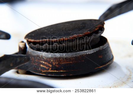 A One Black Rust Gas Burner On White Cooker For Warm Up Food For Eating. Very Old Machine