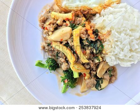 Stir Fried Minced Pork With Basil Eating With Rice And Fried Egg On White Background. Thai Food.