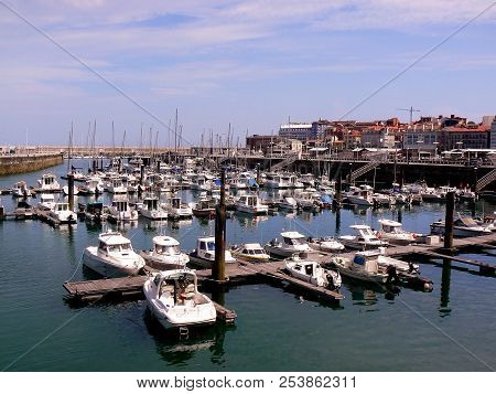 Fishing Boats In The Bay Of The City Of Gijón, Asturias. Spain. Europe
