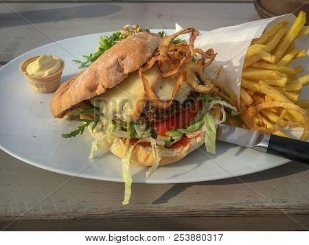 American Beef Burger With Backenholzer Bluecheese, Tomato Relish, Fig Mustard And French Fries