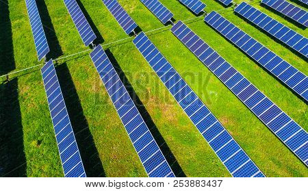 Solar Panel Farm Providing Clean Renewable Energy For Austin , Texas - Green Summer Time Grass With 
