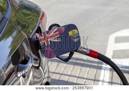 Fueling Car With Petrol Pump At A Gas Station.