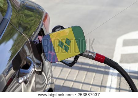 Fueling Car With Petrol Pump At A Gas Station.
