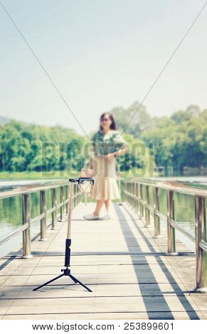 Asia People Use Smart Phone To Selfie, Self-portrait Photography Shoot, Held In The Supported By A S