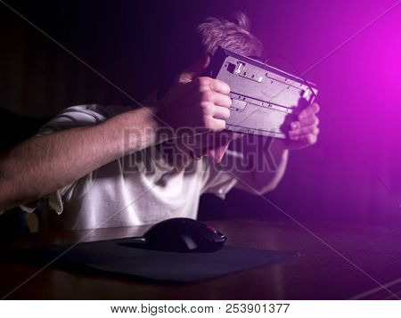 Young Bearded Man Going Crazy Mad And Crashing Breaking The Computer Keyboard Using His Head Late In