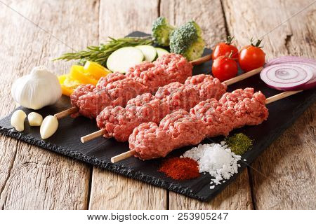 Lyulya, Kofta, Kofte Kebab From Raw Minced Meat On Skewers With Spices, Herbs And Vegetables Close-u
