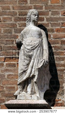 VERONA, ITALY - MAY 27: Female statue on the portal of Saint Eufemia Gothic-style, Roman Catholic church in Verona, Italy, on May 27, 2017.