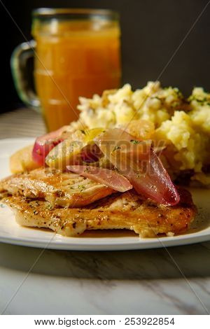 Roasted Pork Chops With Applecider Sauce Sliced Apple Red Onions And Smashed Potatoes