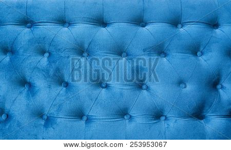 Velour Surface Of Sofa Close-up. Coach-type Velours Screed Tightened With Buttons. Blue Chesterfield