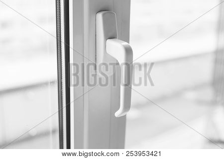 Close-up On A White Handle Of The Pvc Window.