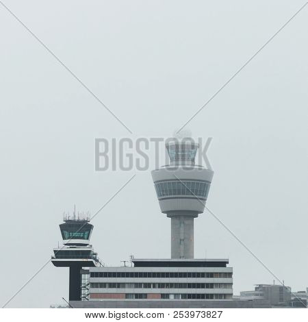 airport traffic control tower at foggy weather