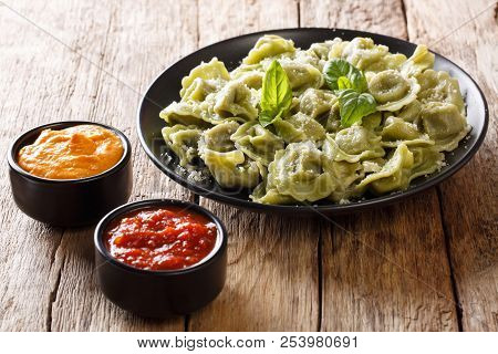 Italian Dinner: Spinach Cappelletti, Ravioli, Tortellini With Cheese, Basil On A Plate, Ketchup, Mus