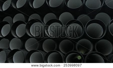 Warehouse Of Finished Plastic Pipes Industrial Outdoors Storage Site. Manufacture Of Plastic Water P