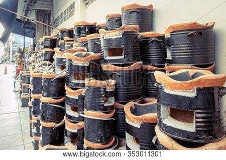 Many Ancient Charcoal Stoves Arranged In A Row Orderly For Sale To Asian Customers At The Grocery St