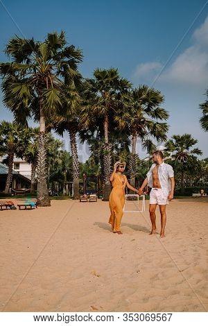 Najomtien Pattaya Thailand, Couple Men And Woman Walking On The Beach During Sunrise In Pattaya Thai