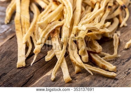 Overview Of Stripes Of Sliced Pancake On Wood