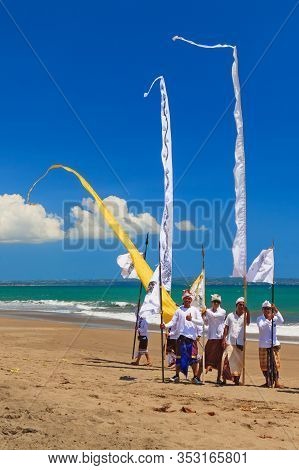 Bali Island, Indonesia - March 18, 2015: Balinese People Procession Walking By Beach With Hindu Scar