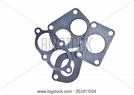 Gasket Set Of Automotive Paronite Exhaust And Intake Manifold With Metal Inserts And Auto Parts On A