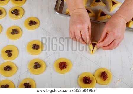 Making Hamentaschen Cookies With Jam For Purim. Jewish Holiday Concept,