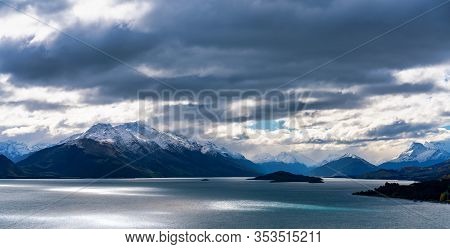 Sun Through Clouds Forming A Dramatic Landscape Of Lake Wakatipu New Zealand