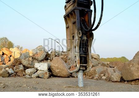 Excavator With Hydraulic Breaker Hammer For The Destruction Of Concrete And Hard Rock At The Constru