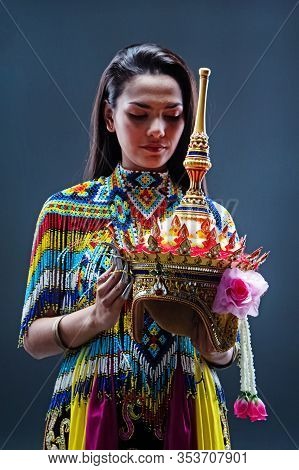 Young Lady Wearing Thai Tradition Southern Costume ,made From Colorful Beads,put Headdress On Her He
