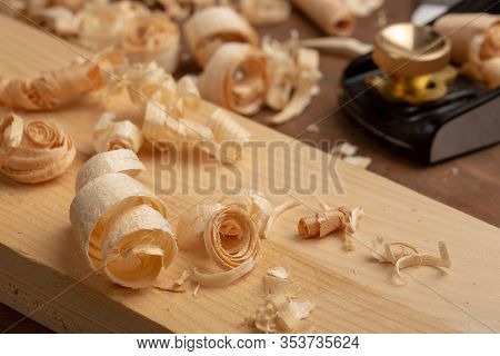 Chisel And Small Block Plane With Wood Shavings