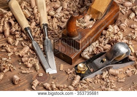 Chisel And Small Block Plane With Wood Shavings