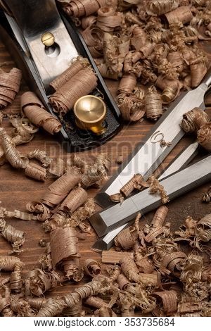 Chisel And Small Block Plane With Wood Shavings