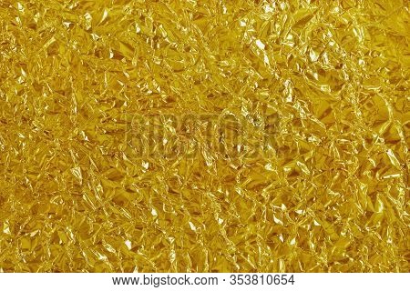 Gold Foil Leaf Shiny Texture, Abstract Yellow Wrapping Paper For Background And Design Art Work.