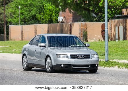 Maun, Botswana - February 9, 2020: Grey Saloon Car Audi A4 In The Town Street.
